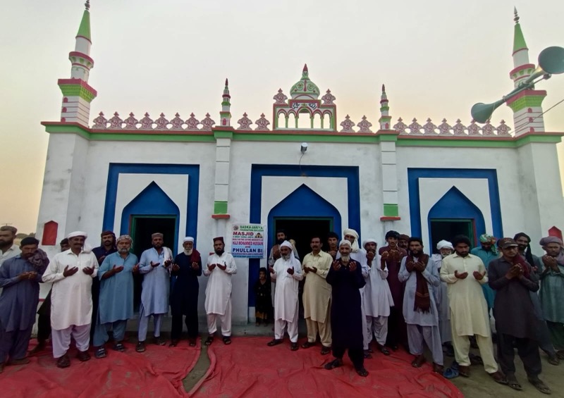A community gathered outside a masjid